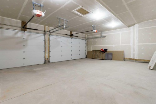 704 Mandalay Boulevard, Carstairs, AB - Indoor Photo Showing Garage
