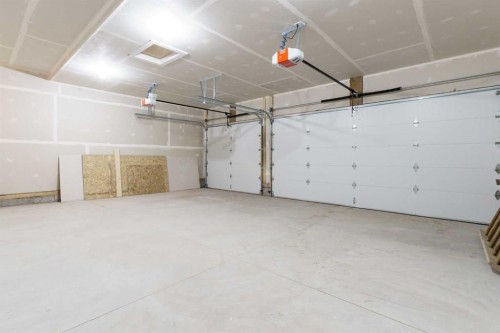 704 Mandalay Boulevard, Carstairs, AB - Indoor Photo Showing Garage
