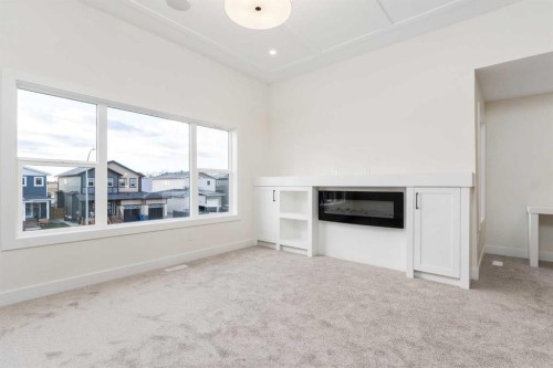 704 Mandalay Boulevard, Carstairs, AB - Indoor With Fireplace