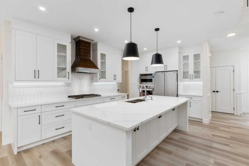 704 Mandalay Boulevard, Carstairs, AB - Indoor Photo Showing Kitchen With Upgraded Kitchen