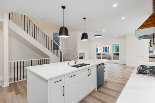 704 Mandalay Boulevard, Carstairs, AB - Indoor Photo Showing Kitchen With Double Sink