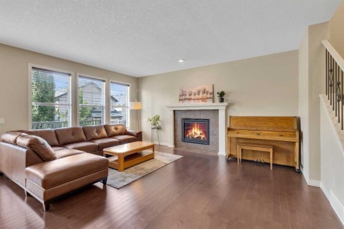 224 Panamount Point Nw, Calgary, AB - Indoor Photo Showing Living Room With Fireplace