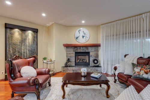 142 Discovery Ridge Boulevard Sw, Calgary, AB - Indoor Photo Showing Living Room With Fireplace