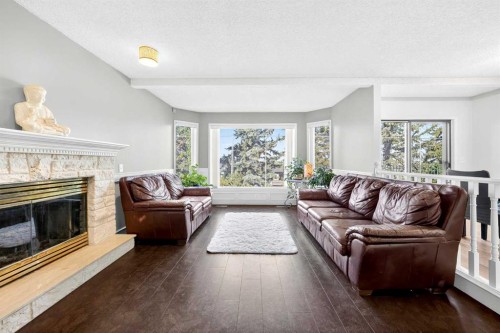 1360 Shawnee Road Sw, Calgary, AB - Indoor Photo Showing Living Room With Fireplace