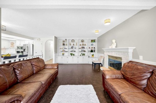 1360 Shawnee Road Sw, Calgary, AB - Indoor Photo Showing Living Room With Fireplace