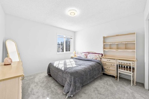 1360 Shawnee Road Sw, Calgary, AB - Indoor Photo Showing Bedroom