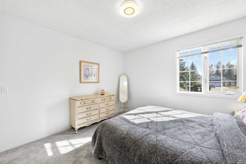 1360 Shawnee Road Sw, Calgary, AB - Indoor Photo Showing Bedroom