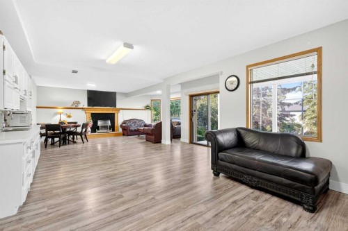 1360 Shawnee Road Sw, Calgary, AB - Indoor Photo Showing Living Room With Fireplace