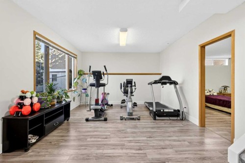 1360 Shawnee Road Sw, Calgary, AB - Indoor Photo Showing Gym Room