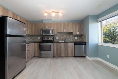 1218-121 Copperpond Common Se, Calgary, AB - Indoor Photo Showing Kitchen With Stainless Steel Kitchen