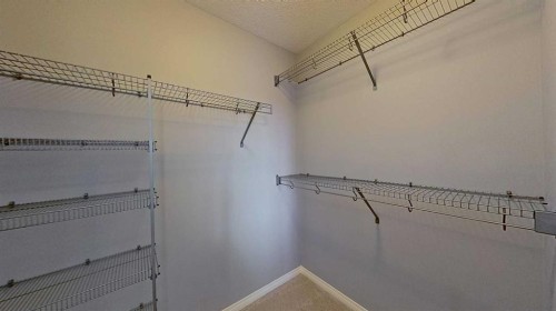 63 Elgin Meadows Park Se, Calgary, AB - Indoor With Storage
