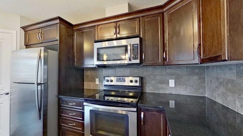 63 Elgin Meadows Park Se, Calgary, AB - Indoor Photo Showing Kitchen With Stainless Steel Kitchen