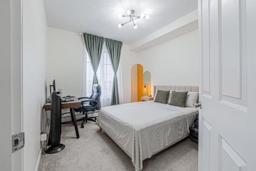 1217-1140 Taradale Drive Ne, Calgary, AB - Indoor Photo Showing Bedroom