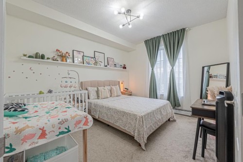 1217-1140 Taradale Drive Ne, Calgary, AB - Indoor Photo Showing Bedroom