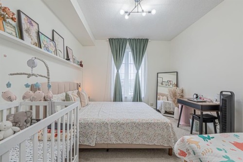 1217-1140 Taradale Drive Ne, Calgary, AB - Indoor Photo Showing Bedroom