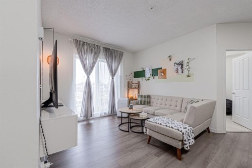 1217-1140 Taradale Drive Ne, Calgary, AB - Indoor Photo Showing Living Room