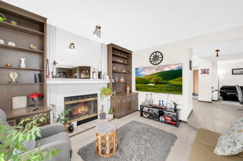 4 Fallingworth Bay Ne, Calgary, AB - Indoor Photo Showing Living Room With Fireplace