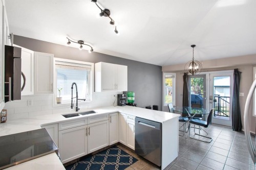 40 Douglas Close, Penhold, AB - Indoor Photo Showing Kitchen With Double Sink