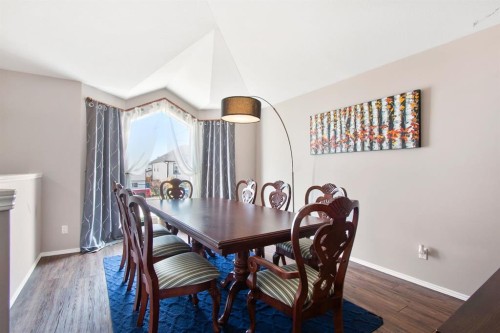 40 Douglas Close, Penhold, AB - Indoor Photo Showing Dining Room With Fireplace