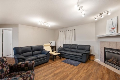 40 Douglas Close, Penhold, AB - Indoor Photo Showing Living Room With Fireplace