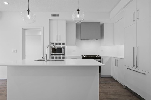 204-8370 Broadcast Avenue Sw, Calgary, AB - Indoor Photo Showing Kitchen With Upgraded Kitchen