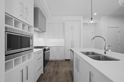 204-8370 Broadcast Avenue Sw, Calgary, AB - Indoor Photo Showing Kitchen With Double Sink With Upgraded Kitchen