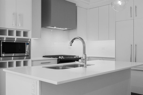 204-8370 Broadcast Avenue Sw, Calgary, AB - Indoor Photo Showing Kitchen With Double Sink With Upgraded Kitchen