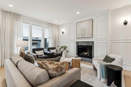 211 Calais Drive Sw, Calgary, AB - Indoor Photo Showing Living Room With Fireplace
