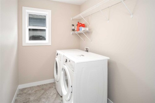 767 Shawnee Drive Sw, Calgary, AB - Indoor Photo Showing Laundry Room