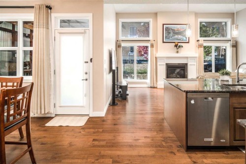 767 Shawnee Drive Sw, Calgary, AB - Indoor With Fireplace