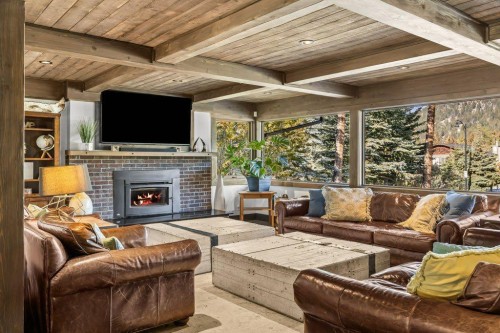115 Spray Avenue, Banff, AB - Indoor Photo Showing Living Room With Fireplace
