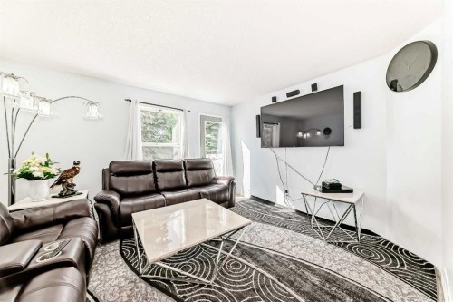 115 Saddlebrook Point Ne, Calgary, AB - Indoor Photo Showing Living Room