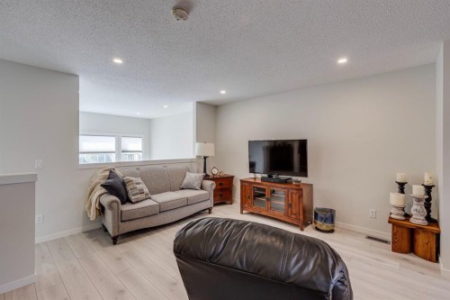 174 Chinook Gate Boulevard Sw, Airdrie, AB - Indoor Photo Showing Living Room
