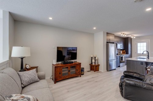 174 Chinook Gate Boulevard Sw, Airdrie, AB - Indoor Photo Showing Living Room