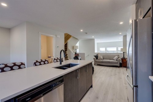 174 Chinook Gate Boulevard Sw, Airdrie, AB - Indoor Photo Showing Kitchen With Double Sink