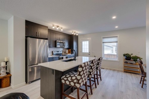 174 Chinook Gate Boulevard Sw, Airdrie, AB - Indoor Photo Showing Kitchen With Double Sink