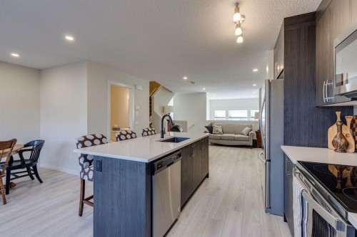 174 Chinook Gate Boulevard Sw, Airdrie, AB - Indoor Photo Showing Kitchen With Upgraded Kitchen