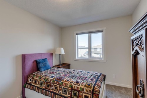 174 Chinook Gate Boulevard Sw, Airdrie, AB - Indoor Photo Showing Bedroom