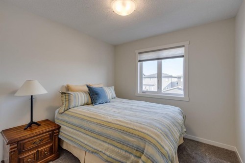 174 Chinook Gate Boulevard Sw, Airdrie, AB - Indoor Photo Showing Bedroom