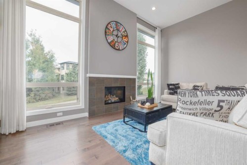 9 Walden Park Se, Calgary, AB - Indoor Photo Showing Living Room With Fireplace