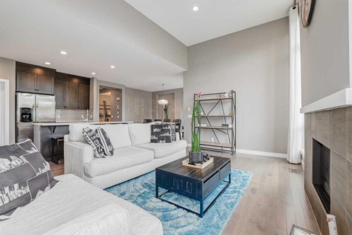 9 Walden Park Se, Calgary, AB - Indoor Photo Showing Living Room With Fireplace