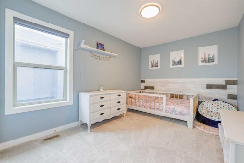 9 Walden Park Se, Calgary, AB - Indoor Photo Showing Bedroom