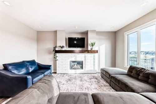 95 Marquis Crescent Se, Calgary, AB - Indoor Photo Showing Living Room With Fireplace