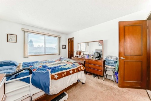108 Jensen Place Ne, Airdrie, AB - Indoor Photo Showing Bedroom