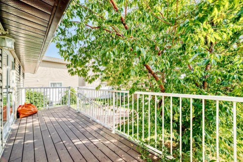 108 Jensen Place Ne, Airdrie, AB - Outdoor With Deck Patio Veranda