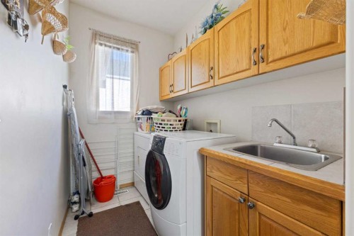 16 Arbour Estates View Nw, Calgary, AB - Indoor Photo Showing Laundry Room