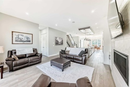 226 21 Avenue Ne, Calgary, AB - Indoor Photo Showing Living Room With Fireplace