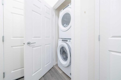 7216-151 Legacy Main Street Se, Calgary, AB - Indoor Photo Showing Laundry Room