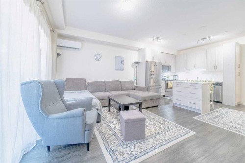 7216-151 Legacy Main Street Se, Calgary, AB - Indoor Photo Showing Living Room