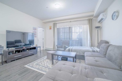 7216-151 Legacy Main Street Se, Calgary, AB - Indoor Photo Showing Living Room